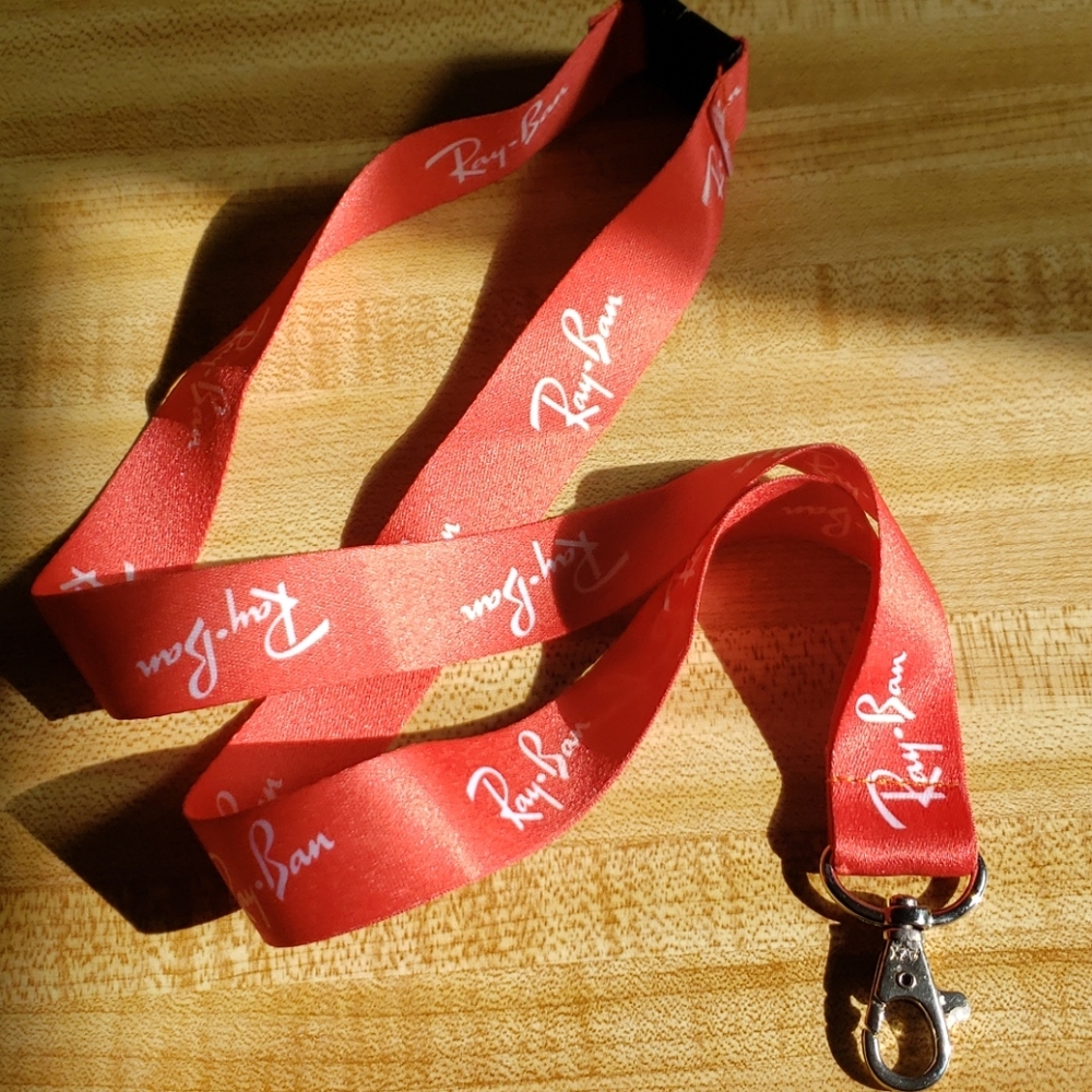 $5 add on item. RayBan lanyard- Never used!